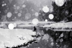 Lone Paddler in Snowstorm